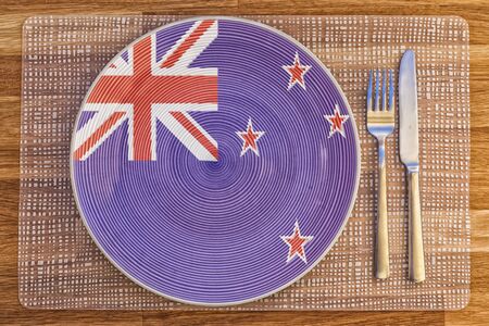 Dinner plate with the flag of New Zealand on it for your international food and drink concepts.の写真素材