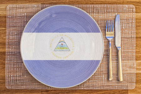 Dinner plate with the flag of Nicaragua on it for your international food and drink concepts.の写真素材