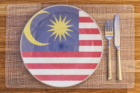 Dinner plate with the flag of Malaysia on it for your international food and drink concepts.の写真素材