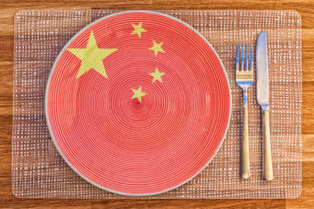 Dinner plate with the flag of China on it for your international food and drink concepts.の写真素材