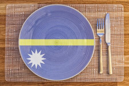 Dinner plate with the flag of Nauru on it for your international food and drink concepts.の写真素材