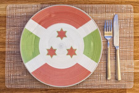 Dinner plate with the flag of Burundi on it for your international food and drink concepts.の写真素材