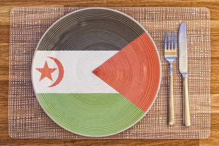 Dinner plate with the flag of Western Sahara on it for your international food and drink concepts.の写真素材