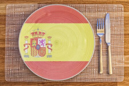 Dinner plate with the flag of Spain on it for your international food and drink concepts.の写真素材