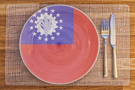 Dinner plate with the flag of Myanmar on it for your international food and drink concepts.の写真素材