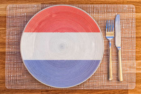 Dinner plate with the flag of Netherlands on it for your international food and drink concepts.の写真素材