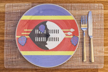 Dinner plate with the flag of Swaziland on it for your international food and drink concepts.の写真素材