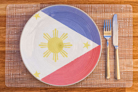 Dinner plate with the flag of Philippines on it for your international food and drink concepts.の写真素材