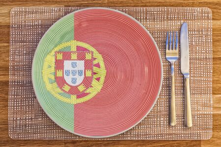 Dinner plate with the flag of Portugal on it for your international food and drink concepts.の写真素材