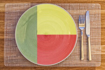 Dinner plate with the flag of Benin on it for your international food and drink concepts.の写真素材