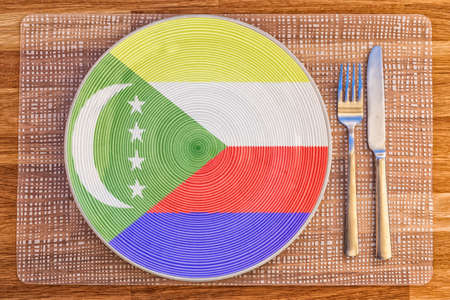Dinner plate with the flag of Comoros on it for your international food and drink concepts.の写真素材
