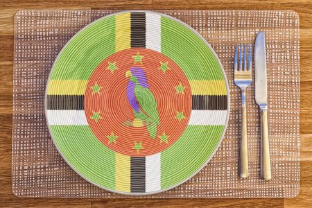 Dinner plate with the flag of Dominica on it for your international food and drink concepts.の写真素材