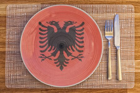 Dinner plate with the flag of Albania on it for your international food and drink concepts.の写真素材