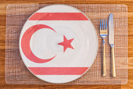 Dinner plate with the flag of Northern Cyprus on it for your international food and drink concepts.の写真素材