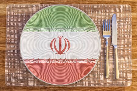 Dinner plate with the flag of Iran on it for your international food and drink concepts.の写真素材