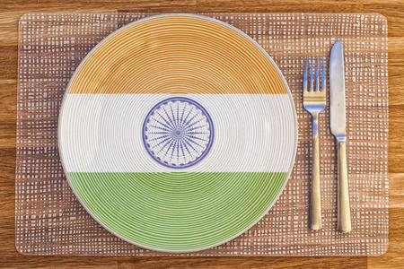 Dinner plate with the flag of India on it for your international food and drink concepts.の写真素材