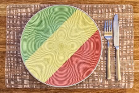 Dinner plate with the flag of Congo Brazzaville on it for your international food and drink concepts.の写真素材