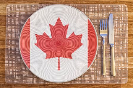 Dinner plate with the flag of Canada on it for your international food and drink concepts.の写真素材