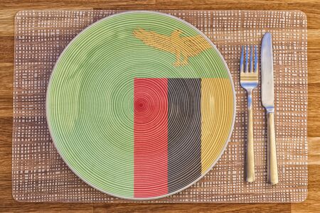 Dinner plate with the flag of Zambia on it for your international food and drink concepts.の写真素材