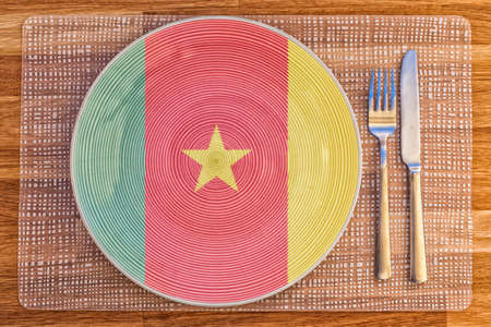 Dinner plate with the flag of Cameroon on it for your international food and drink concepts.の写真素材