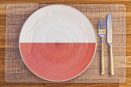 Dinner plate with the flag of Poland on it for your international food and drink concepts.の写真素材