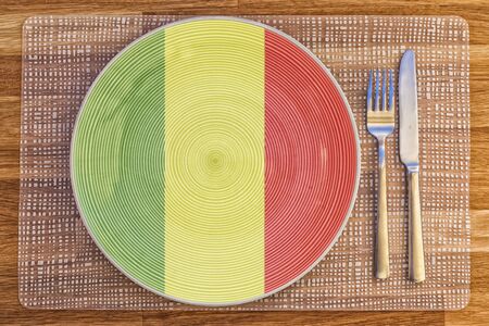 Dinner plate with the flag of Mali on it for your international food and drink concepts.の写真素材