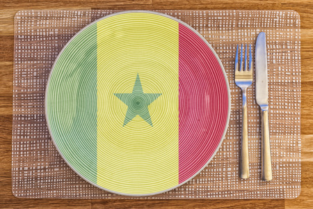 Dinner plate with the flag of Senegal on it for your international food and drink concepts.の写真素材
