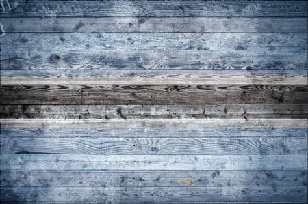 A vignetted background image of the flag of Botswana painted onto wooden boards of a wall or floor.の写真素材