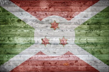 A vignetted background image of the flag of Burundi painted onto wooden boards of a wall or floor.の写真素材