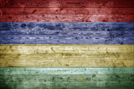 A vignetted background image of the flag of Mauritius painted onto wooden boards of a wall or floor.の写真素材