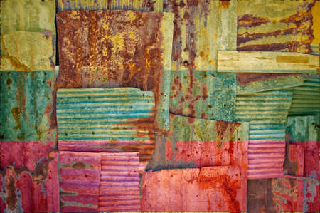 An abstract background image of the flag of Lithuania painted on to rusty corrugated iron sheets...