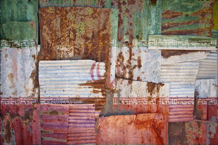 An abstract background image of the flag of Iran painted on to rusty corrugated iron sheets...