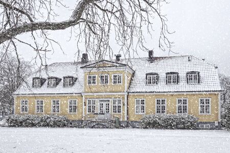A snow covered house situated at ramlosa brunnspark on the outskirts of Helsingborg in Sweden.のeditorial素材