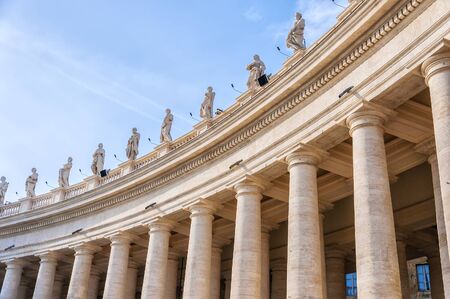 The colossal Tuscan colonnades, four columns deep, frame the trapezoidal entrance to the basilica and the massive elliptical area which precedes it.の写真素材