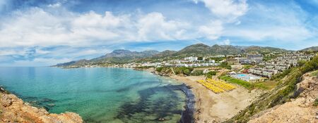 A panoramic view of the coastline from cliffs at Makrygialos on the Greek island of Crete.の写真素材