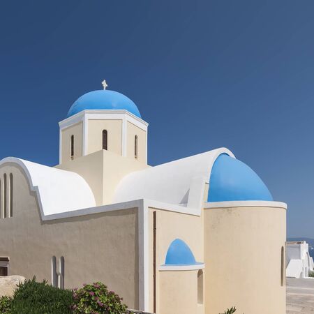 A view of the Church of Saint George in Oia on the greek isle of Santorini.の写真素材