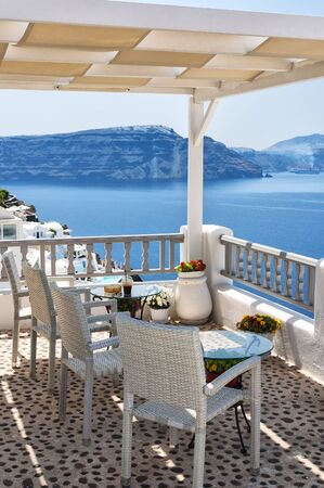 View from a restaurant terrace in Oia, Santorini island in Greece.の写真素材