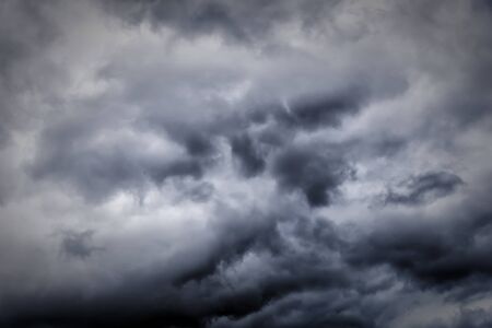 Dark ominous clouds create a dramatic sky background.