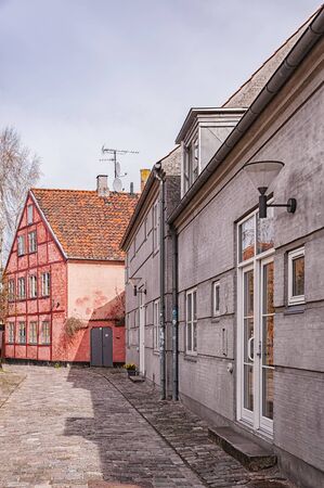 One of the many quaint little narrow streets in the old town of Helsingor in Denmark.の写真素材