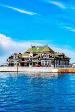 HELSINGBORG, SWEDEN - APRIL 25, 2016: Helsingborg harbour and the recently flitted Tivoli night club that used to be one of the towns old train stations.のeditorial素材