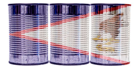 Three tin cans with the flag of American Samoa on them isolated on a white background.の写真素材