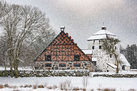 View of a snow covered Hovdala Castle in Hassleholm region. Hovdala Castle is a castle in Hassleholm Municipality, Scania, in southern Sweden.のeditorial素材