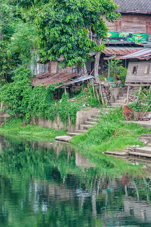 Old run down River shacks in Phetchaburi, Thailand.の写真素材