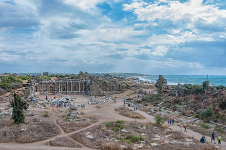 SIDE, TURKEY - OCTOBER 02, 2013: Tourists meandering through the ancient ruins of Side.のeditorial素材