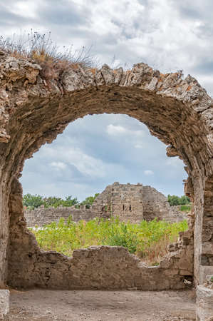 Part of the ancient city wall ruins that surround the town of Side in Turkey as seen from the nearby ancient hospital ruins.の写真素材