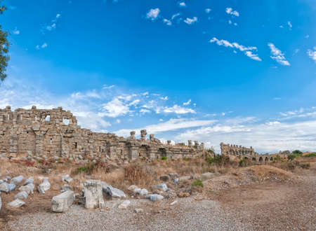 The ancient city wall ruins that surround the town of Side in Turkey.の写真素材