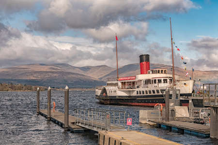 LOCH LOMOND, SCOTLAND - APRIL 05: The paddle steamer 'Maid of the Loch' has just been fully restored for operation on the beautiful Scottish Loch Lomond, Scotland on April 05, 2016.のeditorial素材