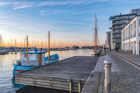 The sun sets at the norra hamnen Marina at Helsingborg in Sweden.の写真素材