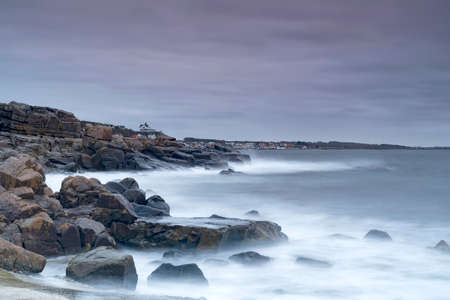 Rocky beach landscape at dusk. Kullaberg, Sweden.