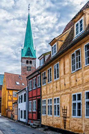 One of the many quaint little narrow streets in the old town of Helsingor in Denmark.のeditorial素材